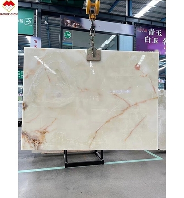 Traslucide marmo bianco Onyx grande lastra retroilluminata vene rosso/oro per la decorazione degli alberghi